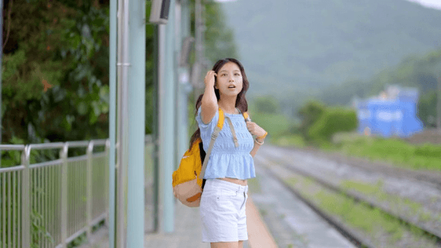 Young woman waiting at a train station