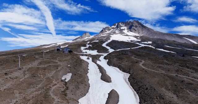 Snow-covered mountain under a clear sky