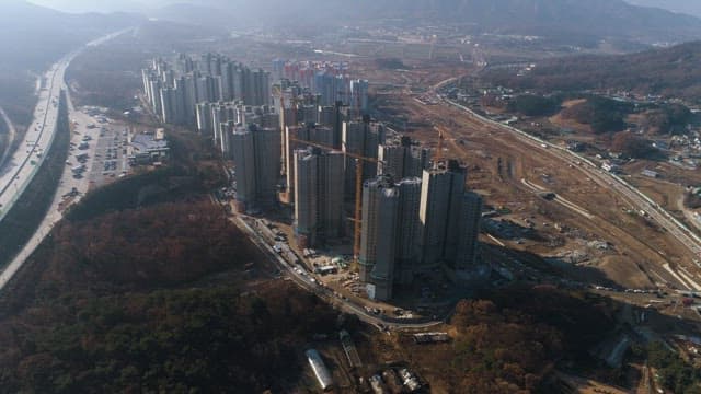 Apartment Construction Site Next to the Highway