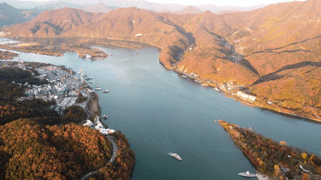 Scenic river surrounded by autumn mountains.