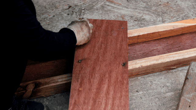 Person working with wooden planks