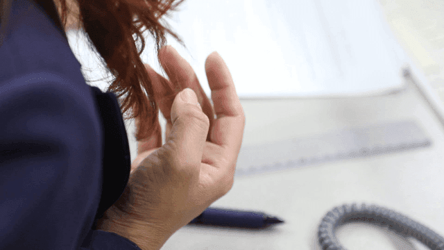 Person in a meeting at a desk