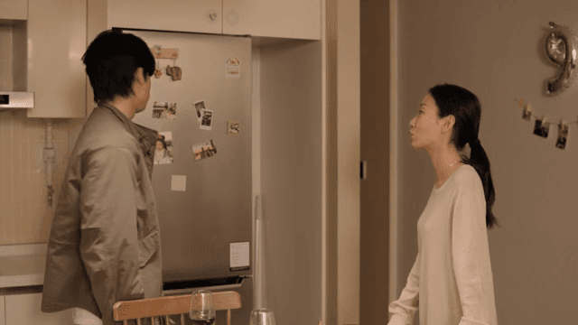 Couple having a serious conversation in the kitchen