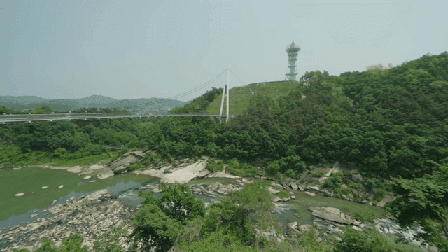 Suspension bridge over blue valley