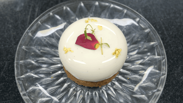 Elegant dessert decorated with gold leaf and flowers