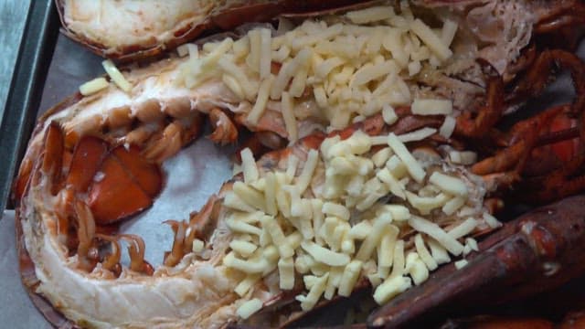 Lobster cooking process topped with cheese