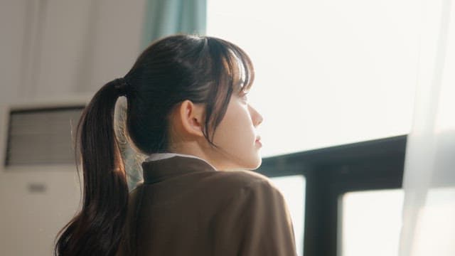 Student looking out the classroom window