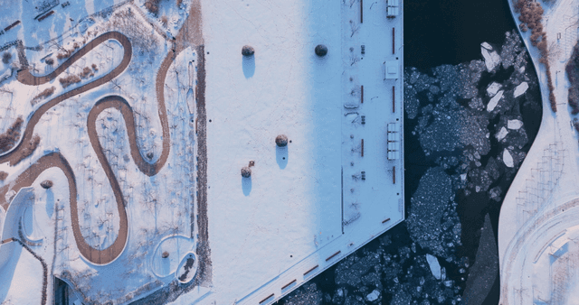 Snow-covered park and frozen lake