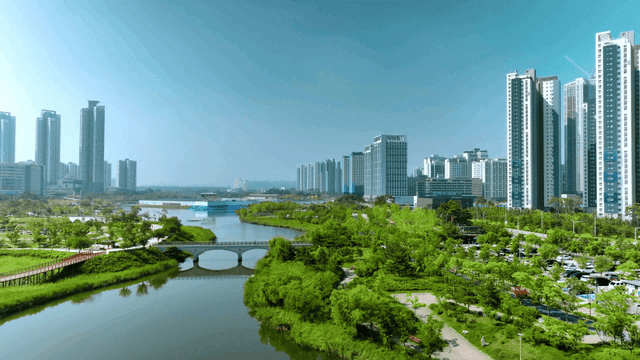 Modern city landscape with rivers and greenery