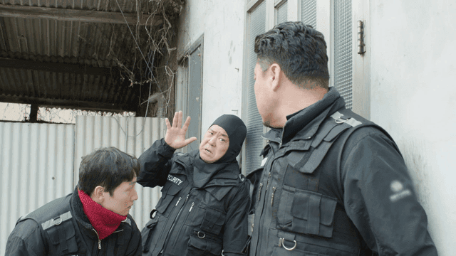 Security guards preparing to enter a building