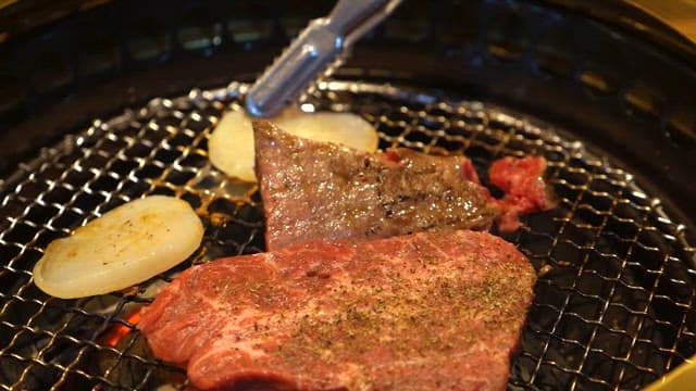 Grilled Meats Cooking on a Charcoal Grill