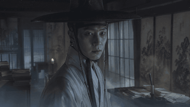 Joseon scholar wearing traditional Hanbok in dark room