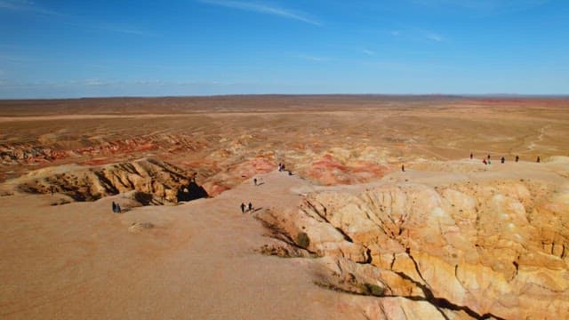 Visitors Exploring Colorful Desert Canyon