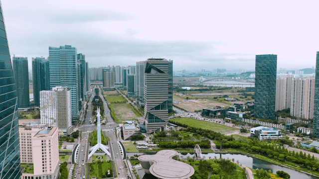Modern cityscape with skyscrapers and greenery