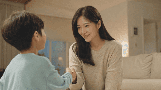 House where woman and child warmly shake hands