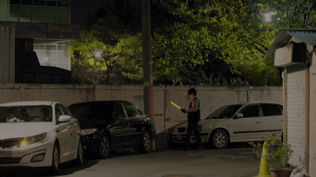 Patrolman checking a parked car