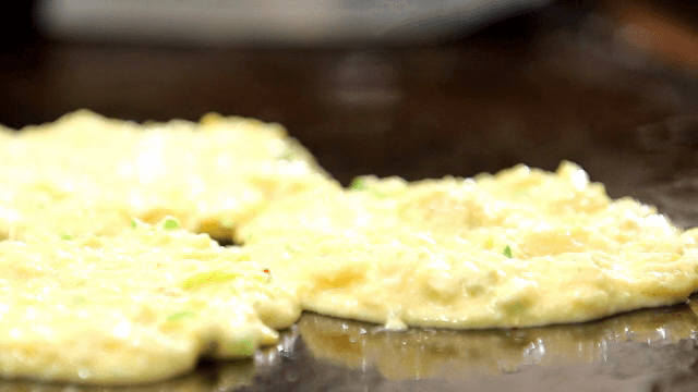 Mung bean pancake batter on an iron plate