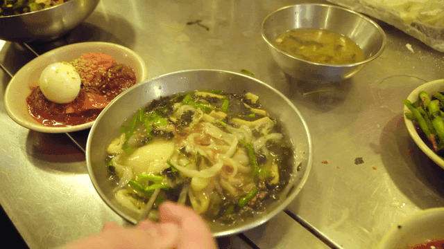 Hot sujebi served with side dishes