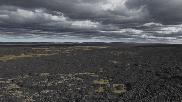 Vast rocky landscape under cloudy sky