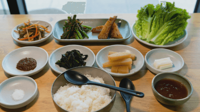 Various Korean side dishes on table