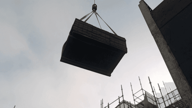 건설 현장에서 자재를 내리는 크레인