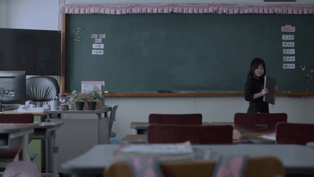 Child heading to his desk as he leaves the classroom