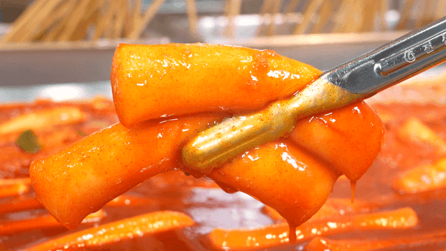 Tteokbokki simmering in spicy sauce