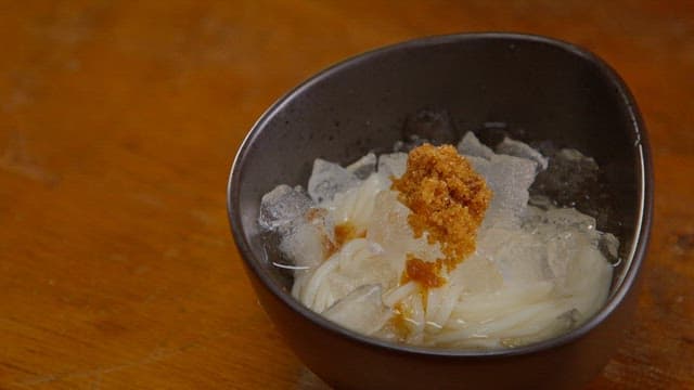 Bowl of noodles with ice and brown sugar