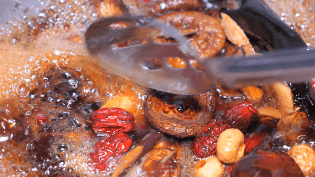 Herbal ingredients boiling in a pot