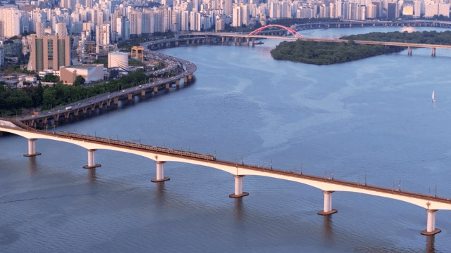 Train crossing a bridge over a river