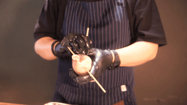 Chef who makes holes in squid with skewer