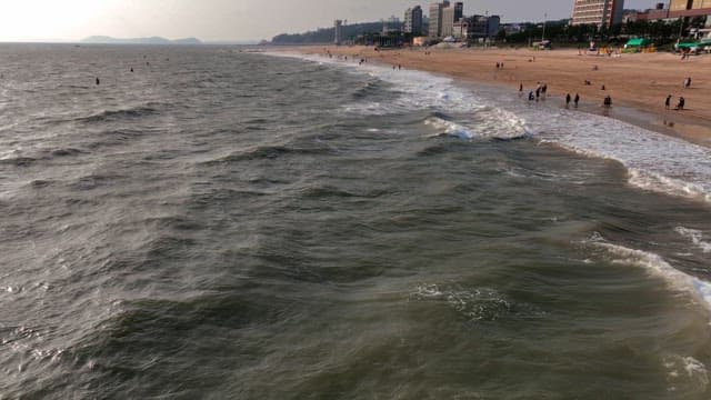 Waves crashing on a sandy beach