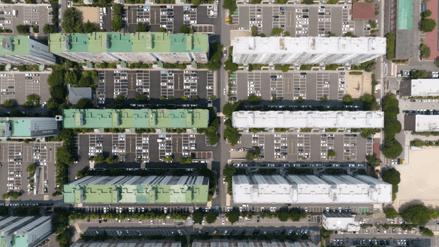 Aerial view of apartment complex and parking