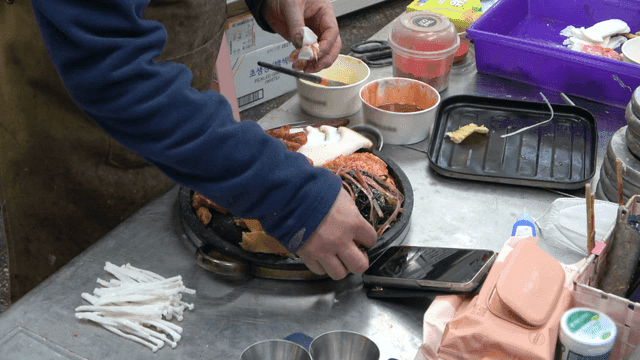 Craftsmen making model of samgyeopsal Korean food table