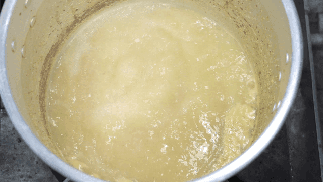 Broth boiling on stove.
