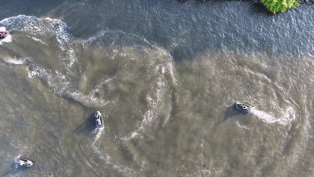 Jet skis racing on water