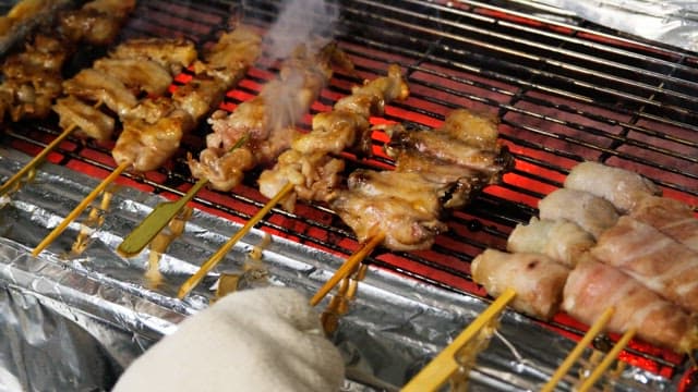 Grilled skewers sizzling deliciously on a red-hot grill