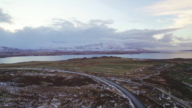 Snow-covered mountains and a serene lake