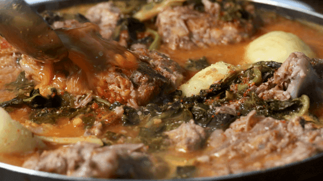 Gamjatang with rich broth containing meat and vegetables