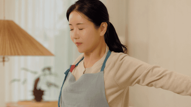 Woman stretching in living room