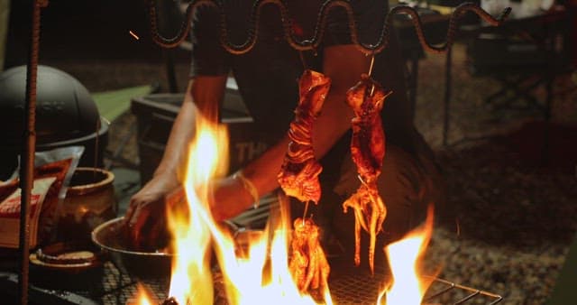 Sizzling squid being cooked on a grill