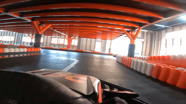 Indoor go-kart track with vibrant lights