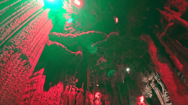 Colorful lights illuminating a cave
