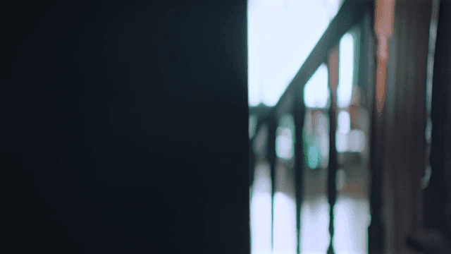 First-person view walking from a dark room into a hallway