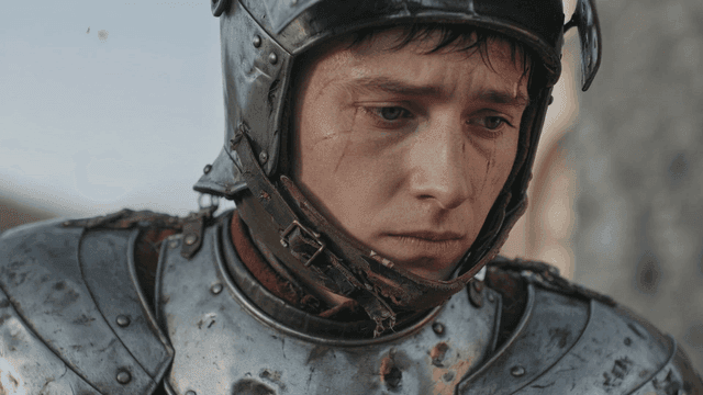 Knight in medieval European armor with focused expression