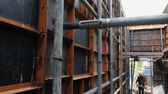 Construction site with scaffolding and worker