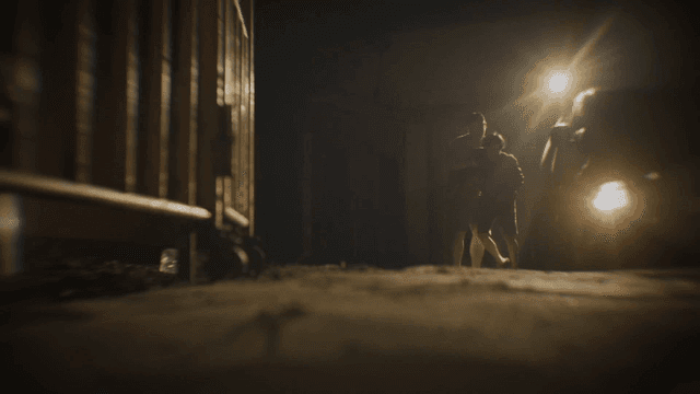 Person being dragged out of car and falling down