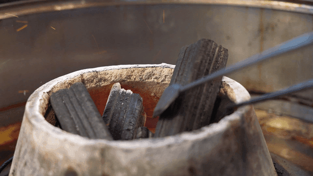 Charcoal rising from traditional brazier