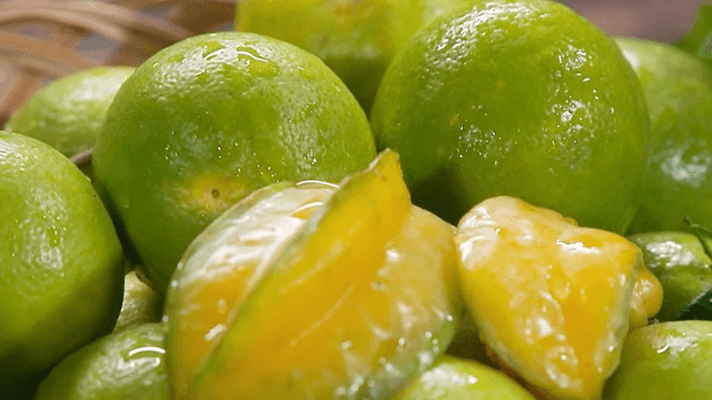 Fresh green limes in a basket