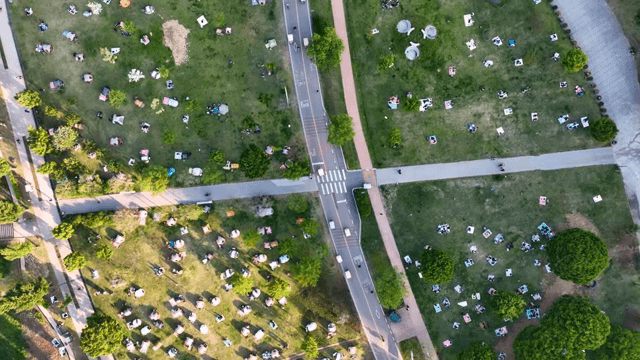 Park filled with tents and people relaxing